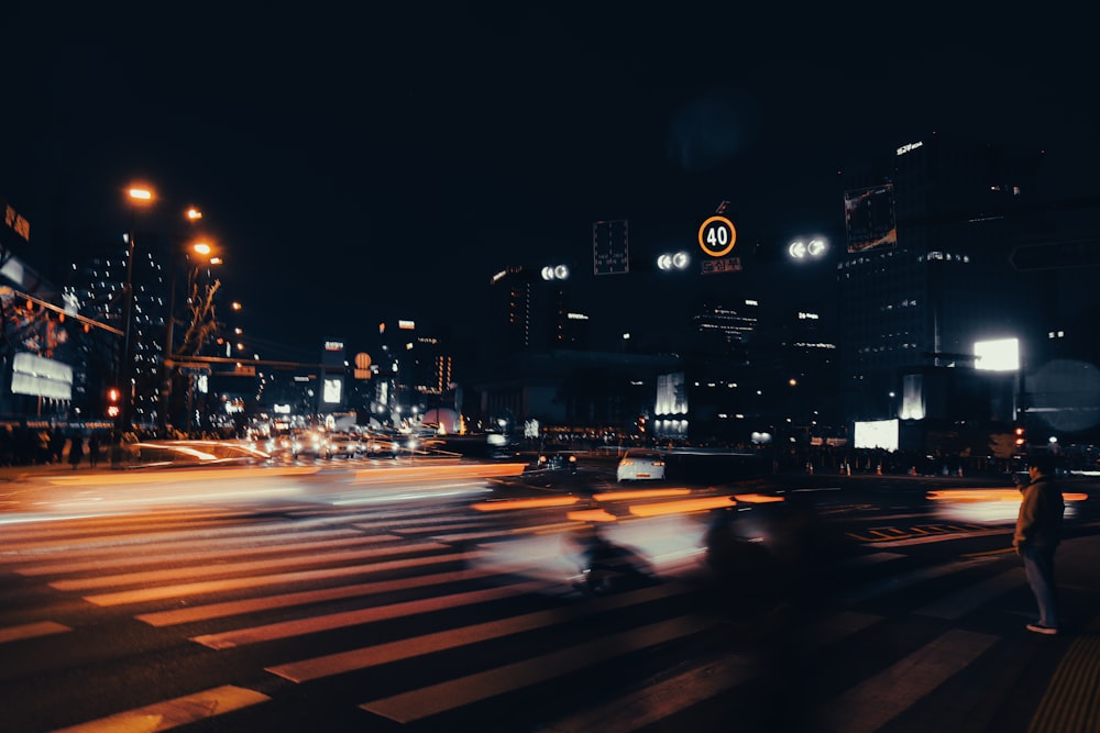 a blurry photo of a city street at night