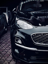 a close up of a car on a cobblestone street