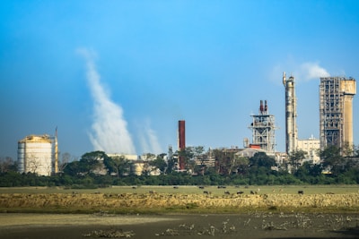 a factory with a lot of smoke coming out of it
