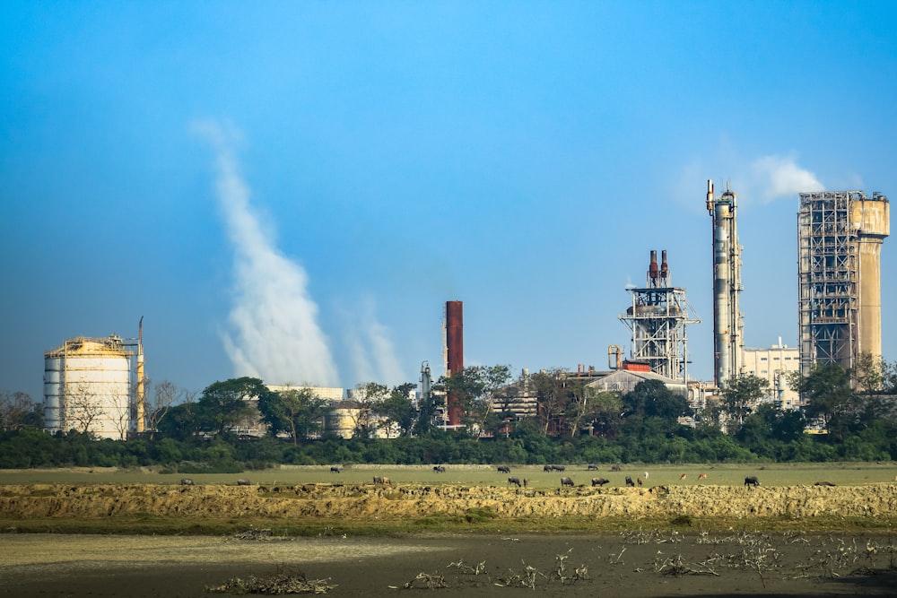 a factory with a lot of smoke coming out of it