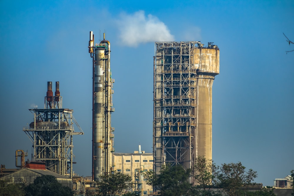 a factory with smoke coming out of the stacks