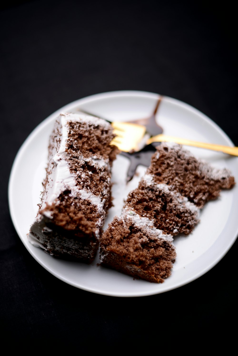 a white plate topped with slices of chocolate cake