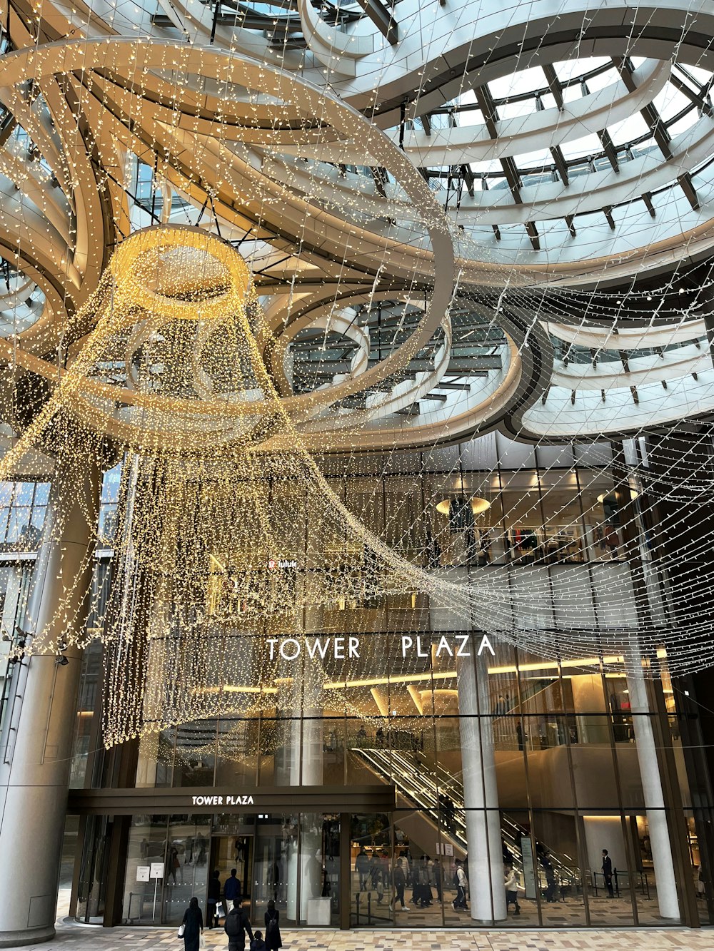 a large building with a lot of lights hanging from it's ceiling