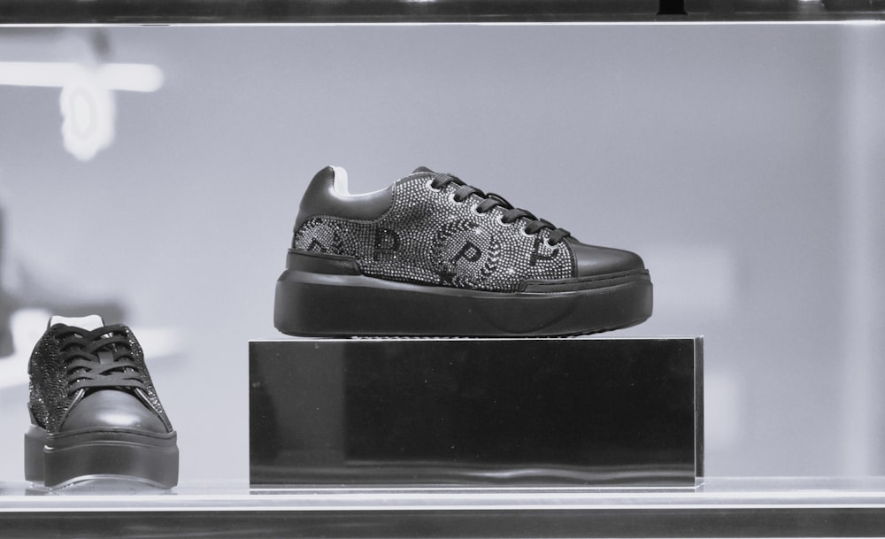 a black and white photo of a pair of sneakers