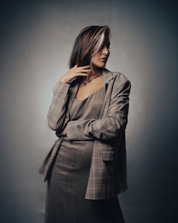 a woman in a suit posing for a picture