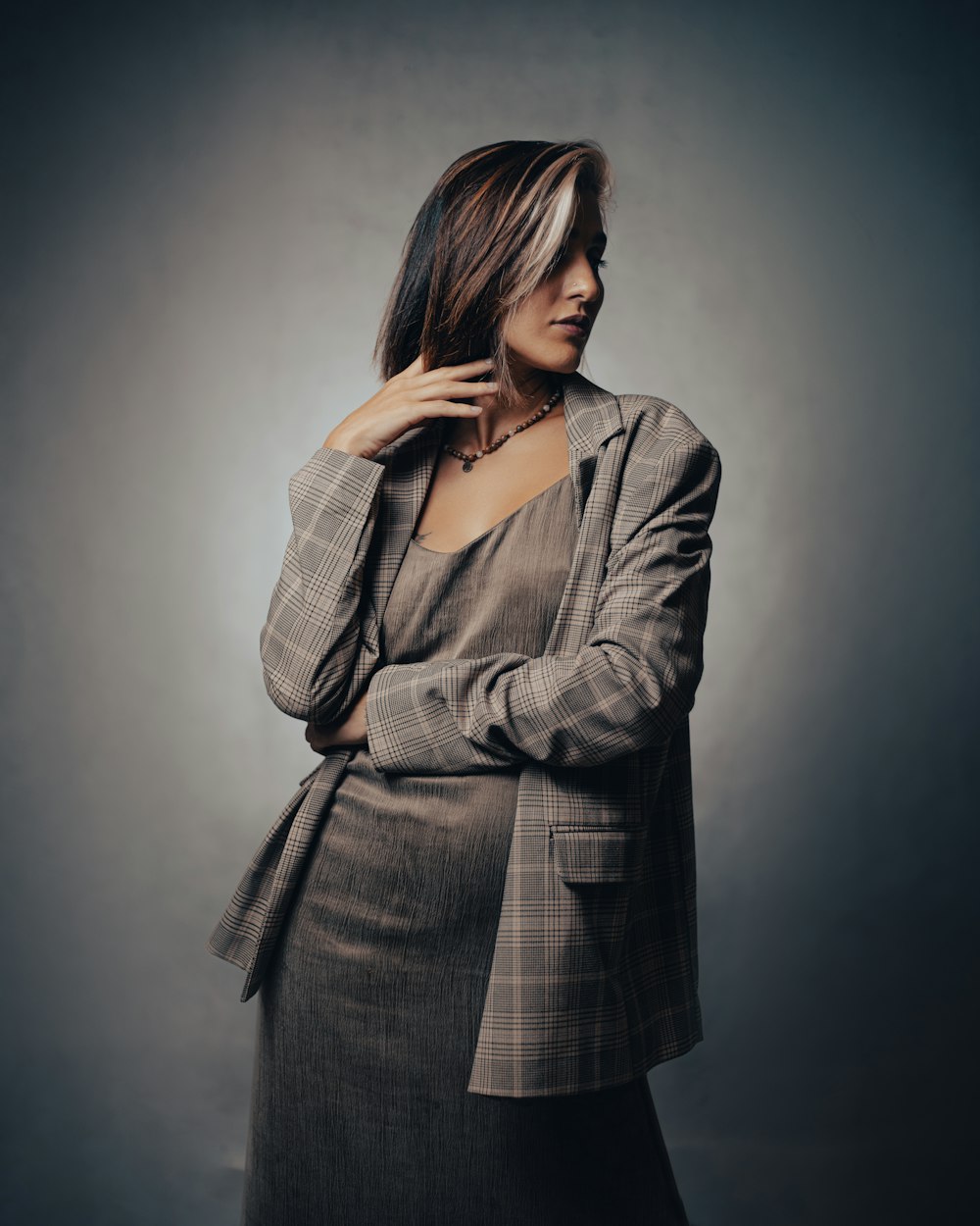 a woman in a suit posing for a picture