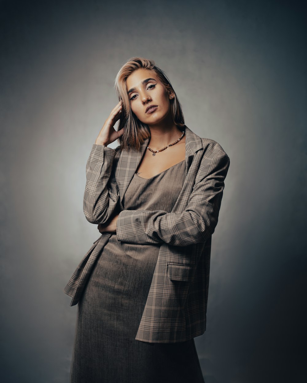 a woman in a suit posing for a picture