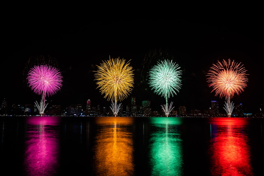 a group of fireworks are lit up in the night sky