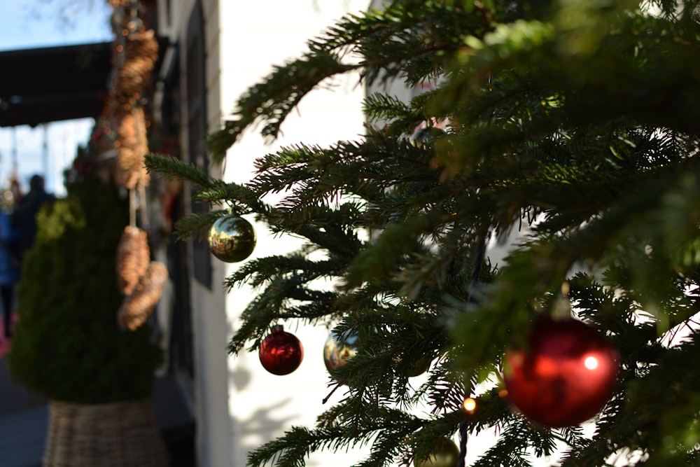 a close up of a christmas tree with ornaments