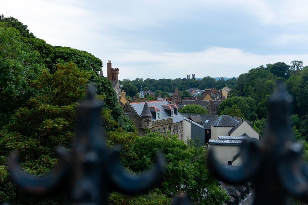 a view of a city through a fence