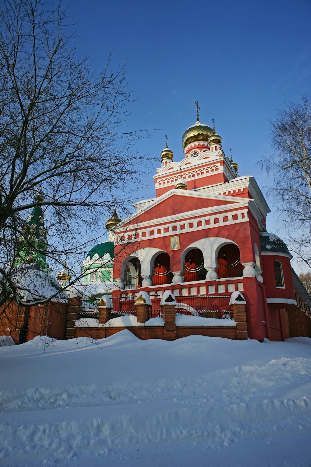 a red and white building surrounded by snow