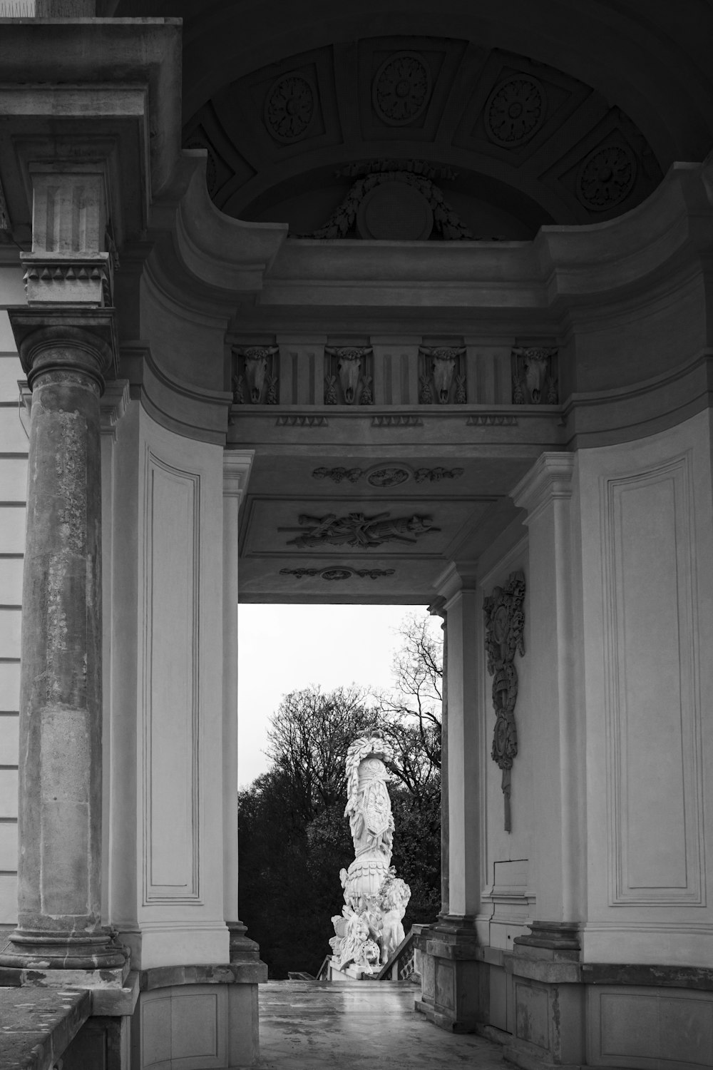 a black and white photo of a statue