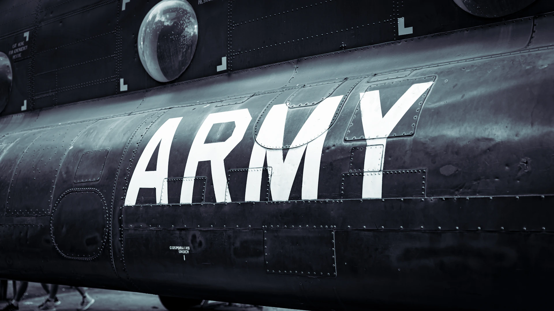 a black army plane with the word army painted on it
