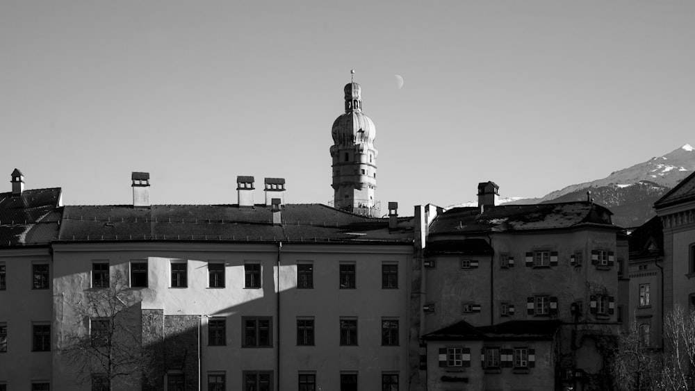 a black and white photo of a building with a clock tower