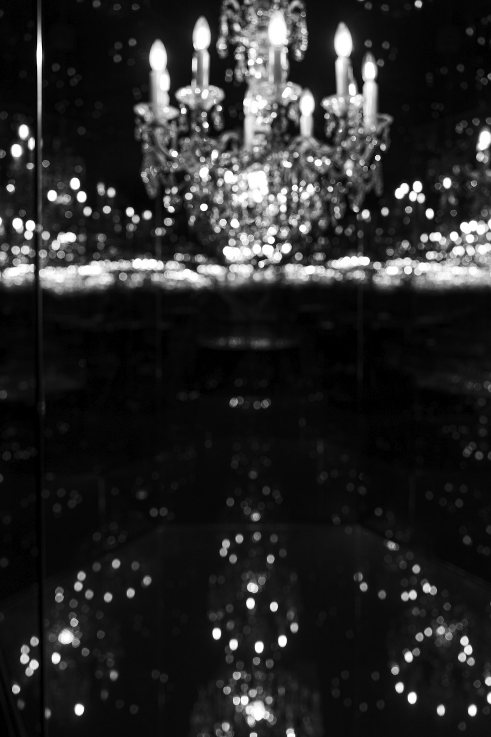 a black and white photo of a chandelier