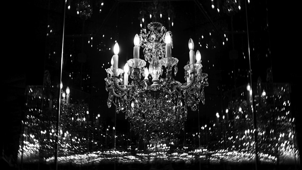 a chandelier in a black and white photo