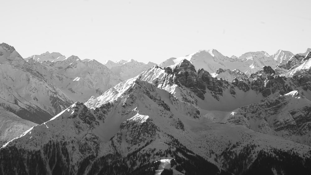 a black and white photo of a mountain range