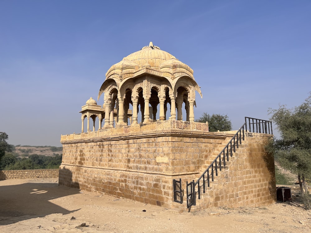 a stone building with a staircase leading up to it