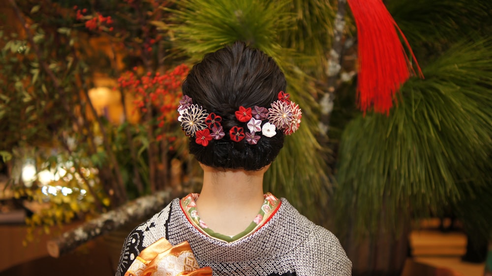 a woman with a flower in her hair