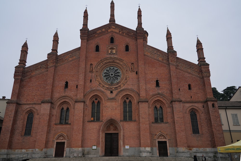 a large brick building with a clock on the front of it