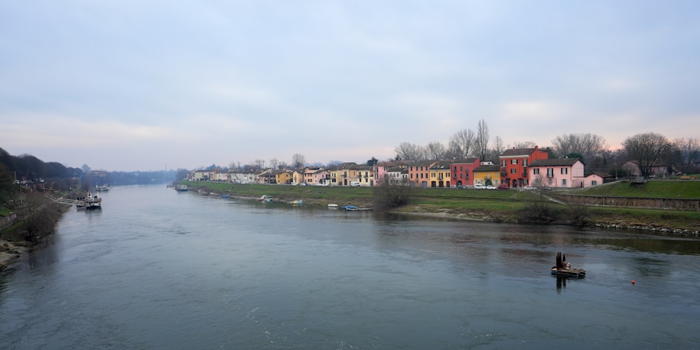 a river running through a lush green countryside