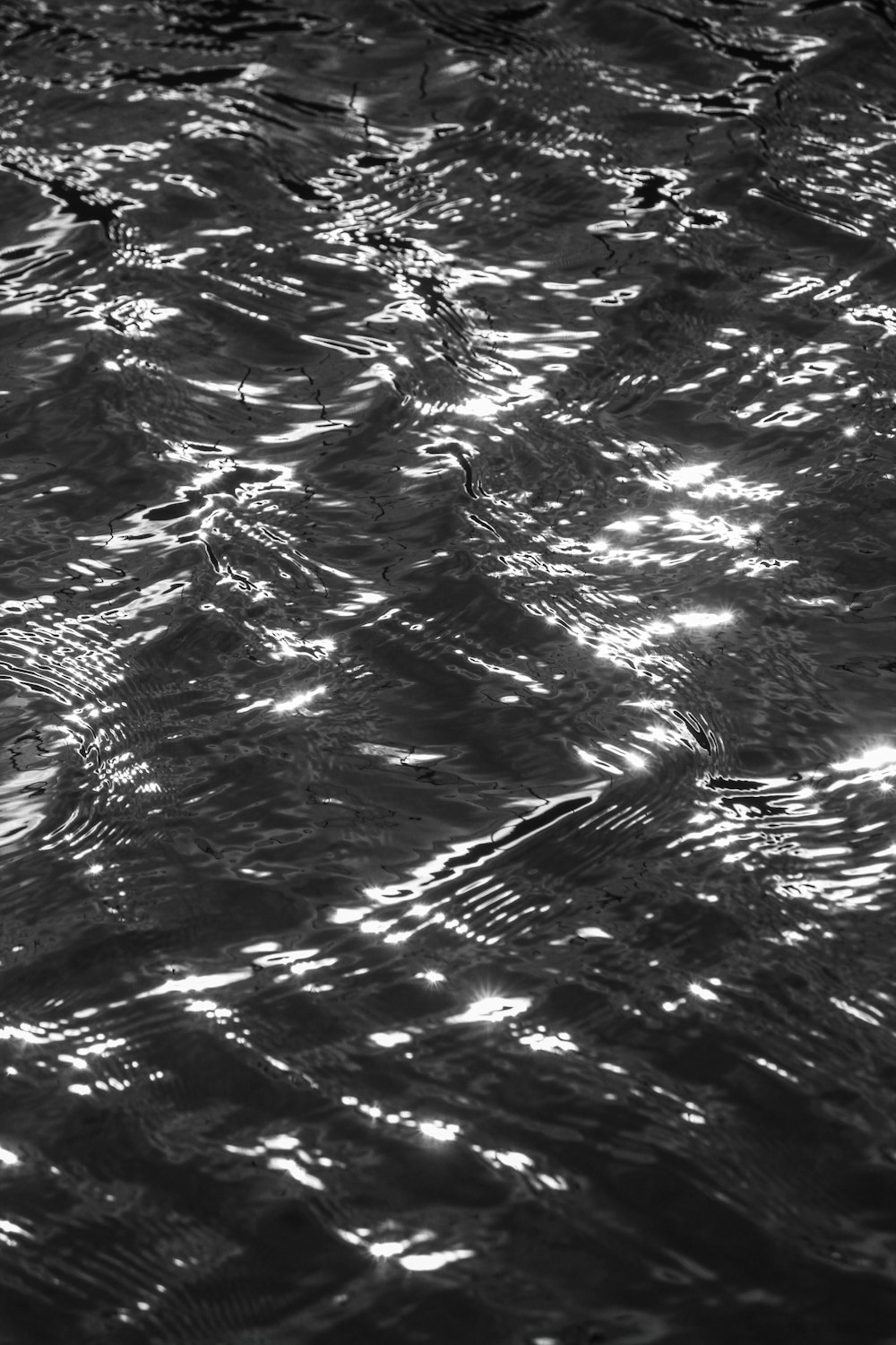 a black and white photo of the water
