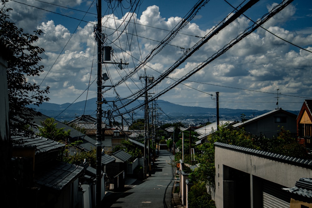 a view of a street with power lines above it
