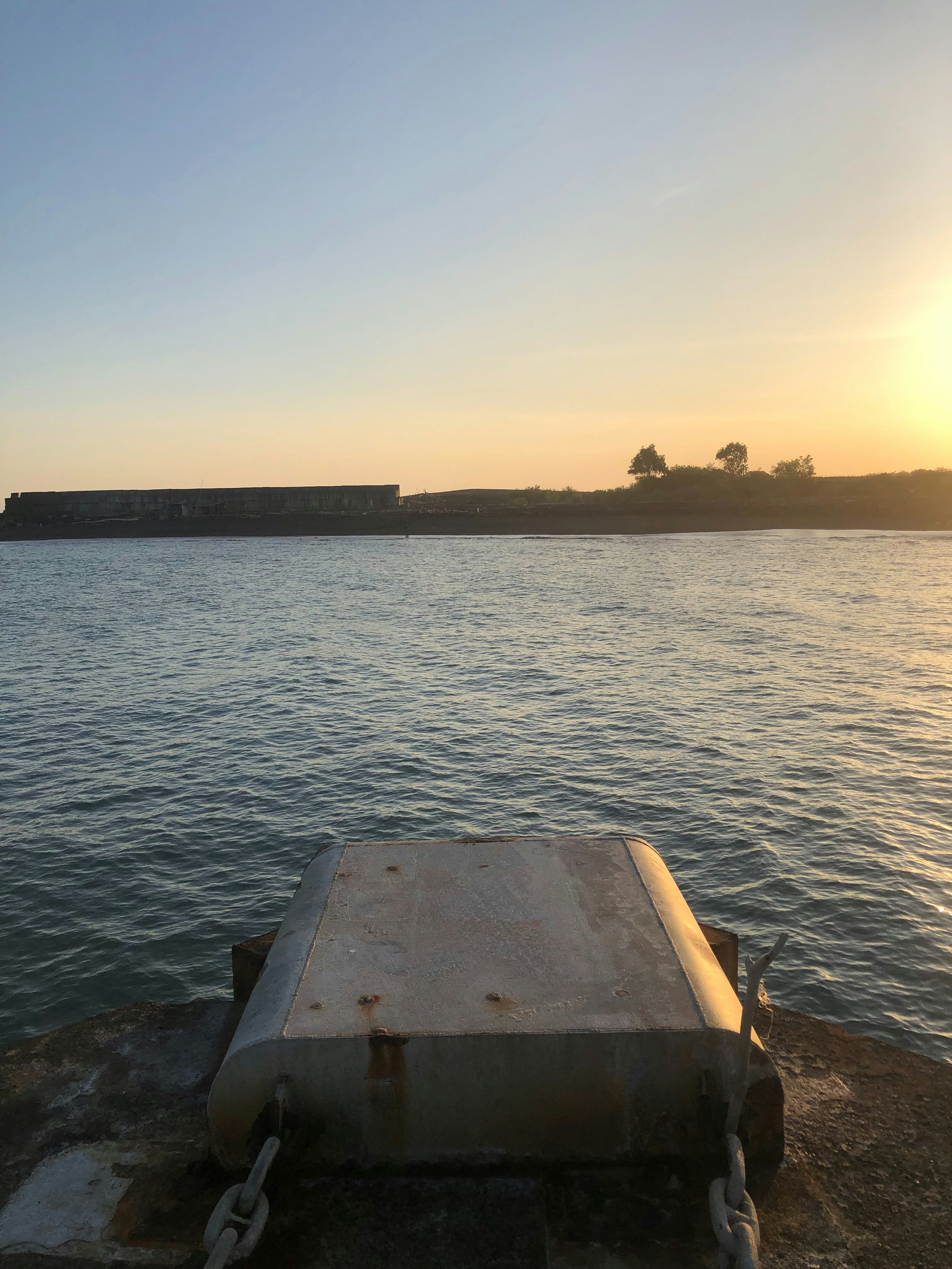 a boat sitting on top of a body of water