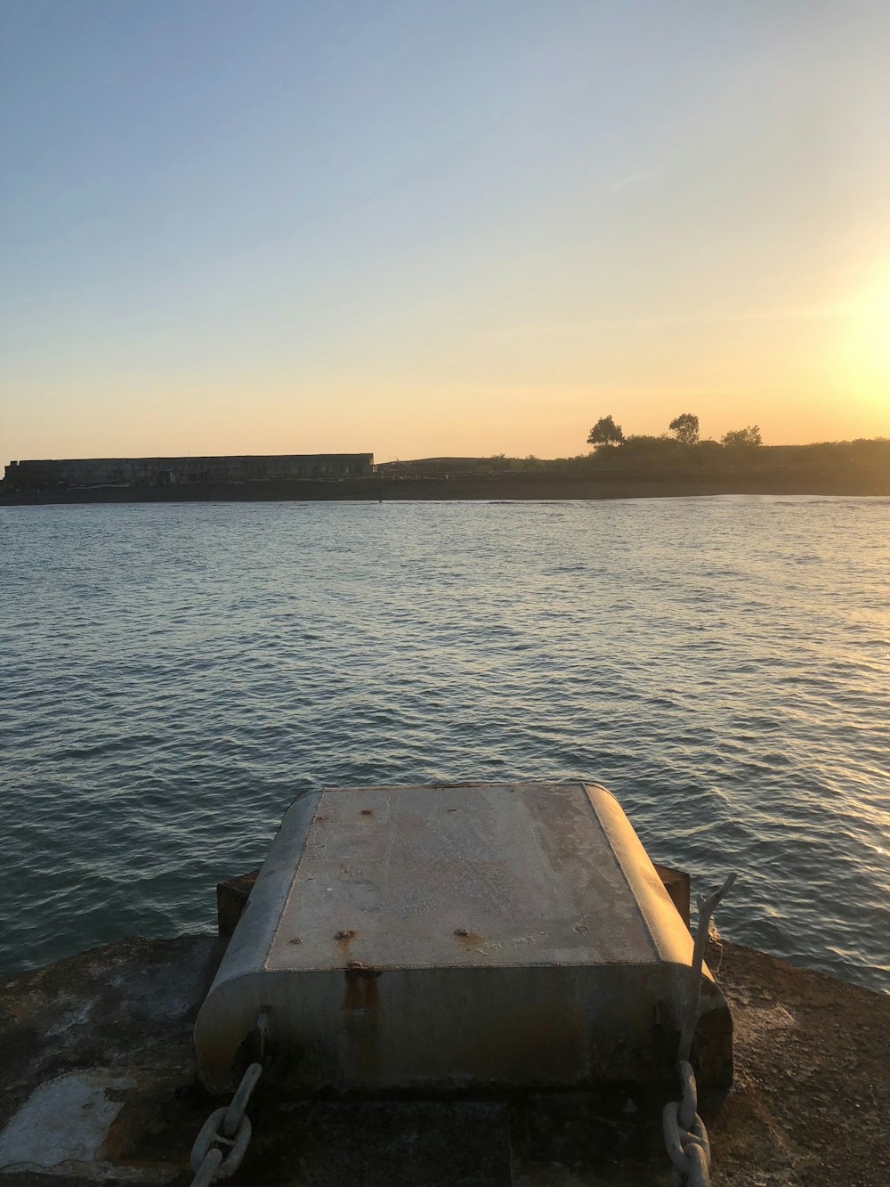 a boat sitting on top of a body of water