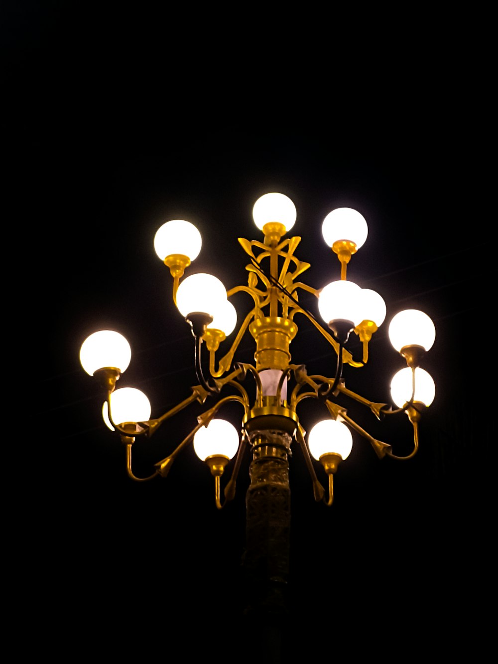 a street light is lit up in the dark