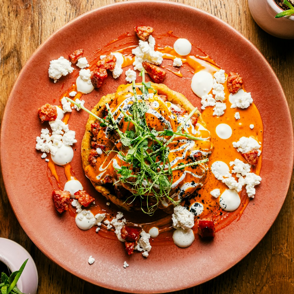 a plate of food on a wooden table