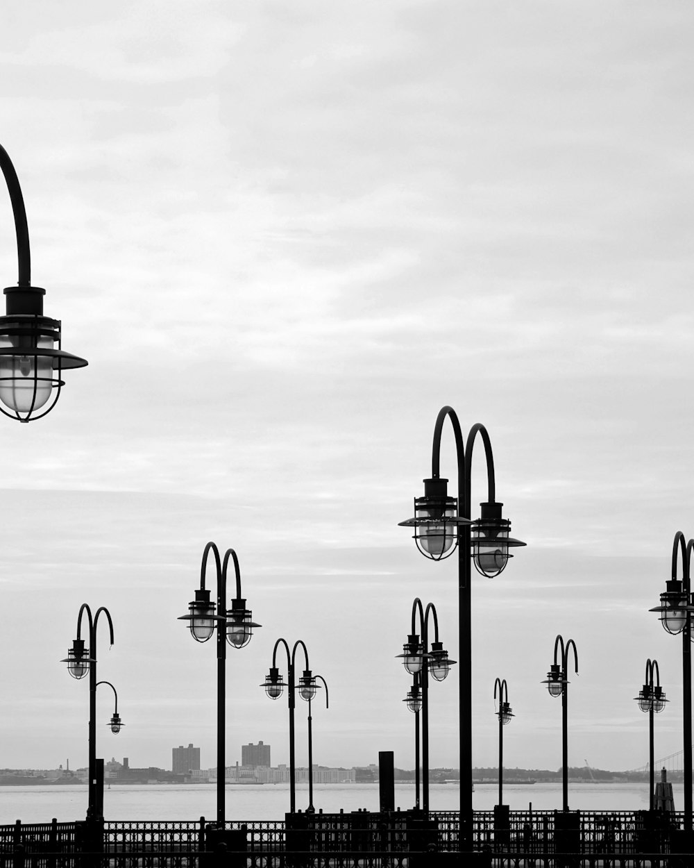 a black and white photo of a street light