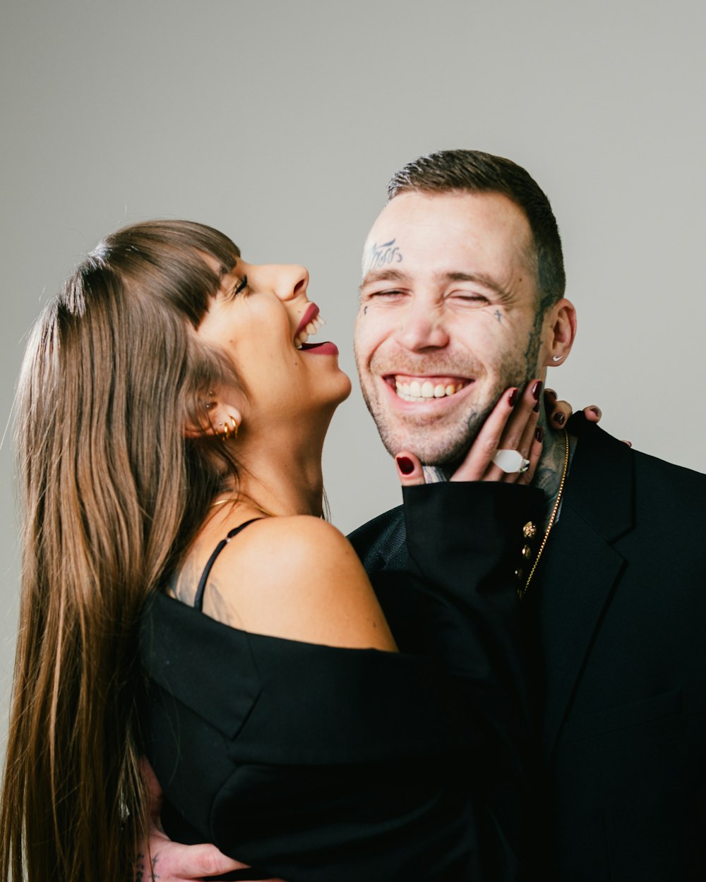 a man and a woman hugging each other