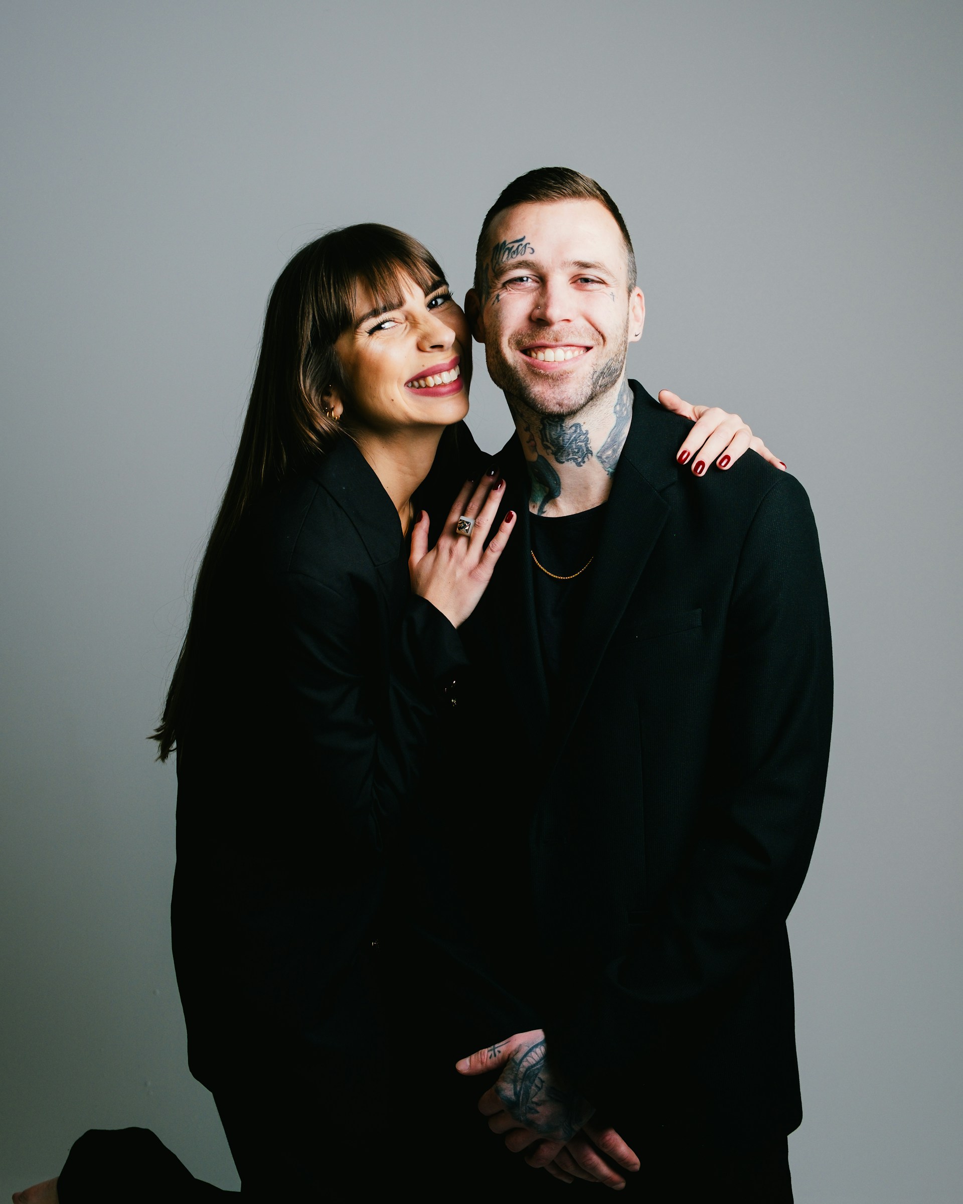 a man and a woman posing for a picture
