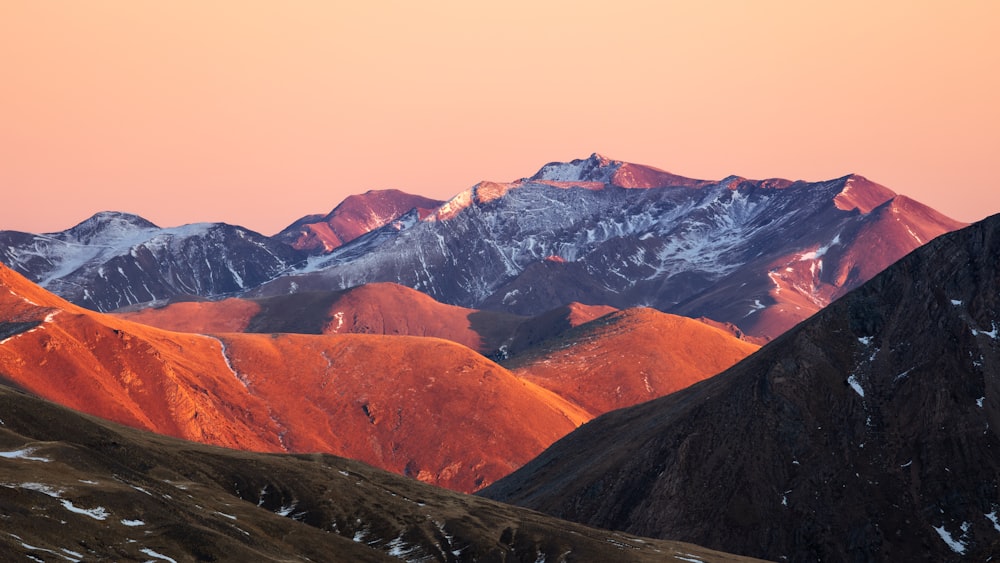 a view of a mountain range at sunset