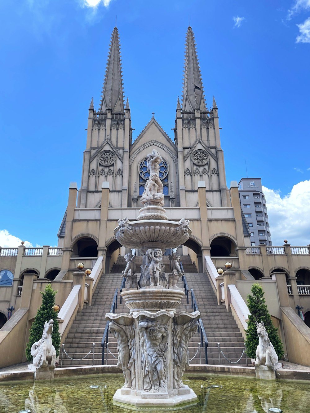 a fountain in front of a large building