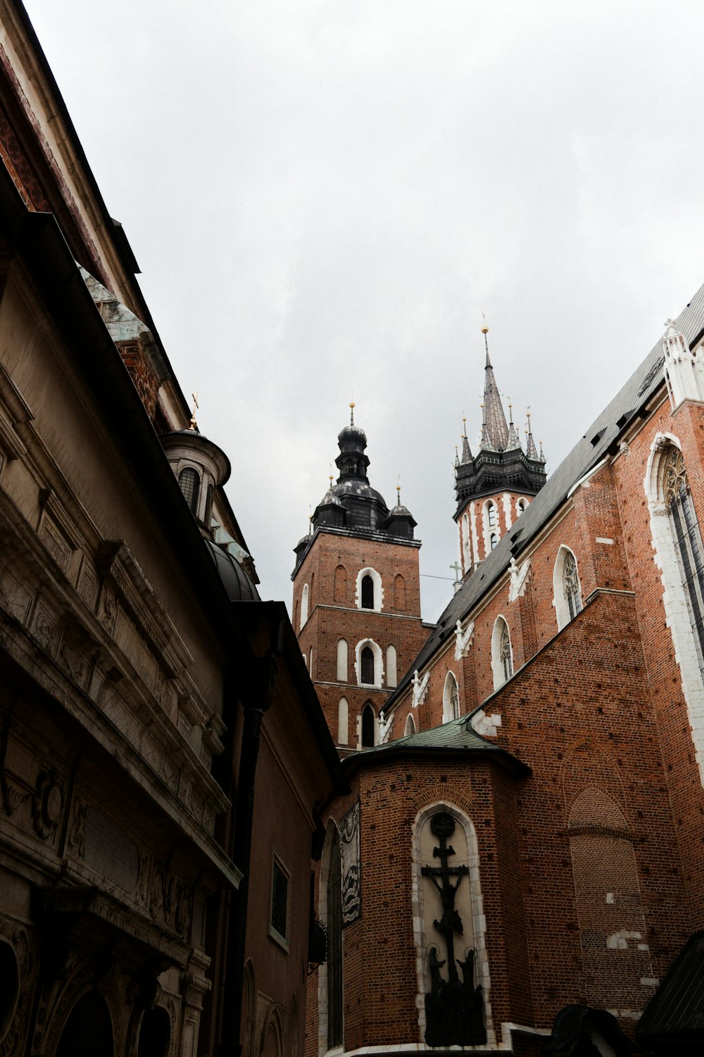 a tall brick building with a clock on it's side