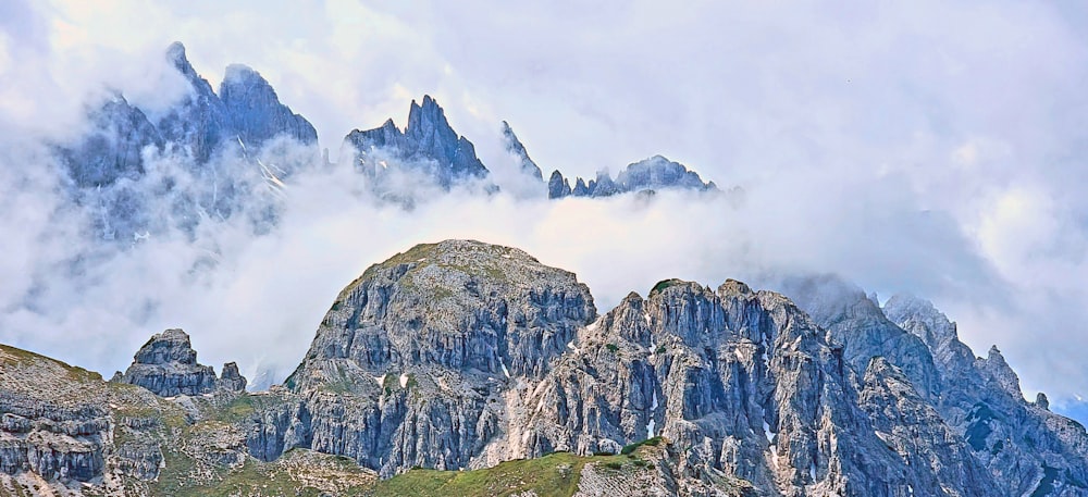 a mountain range covered in clouds and fog