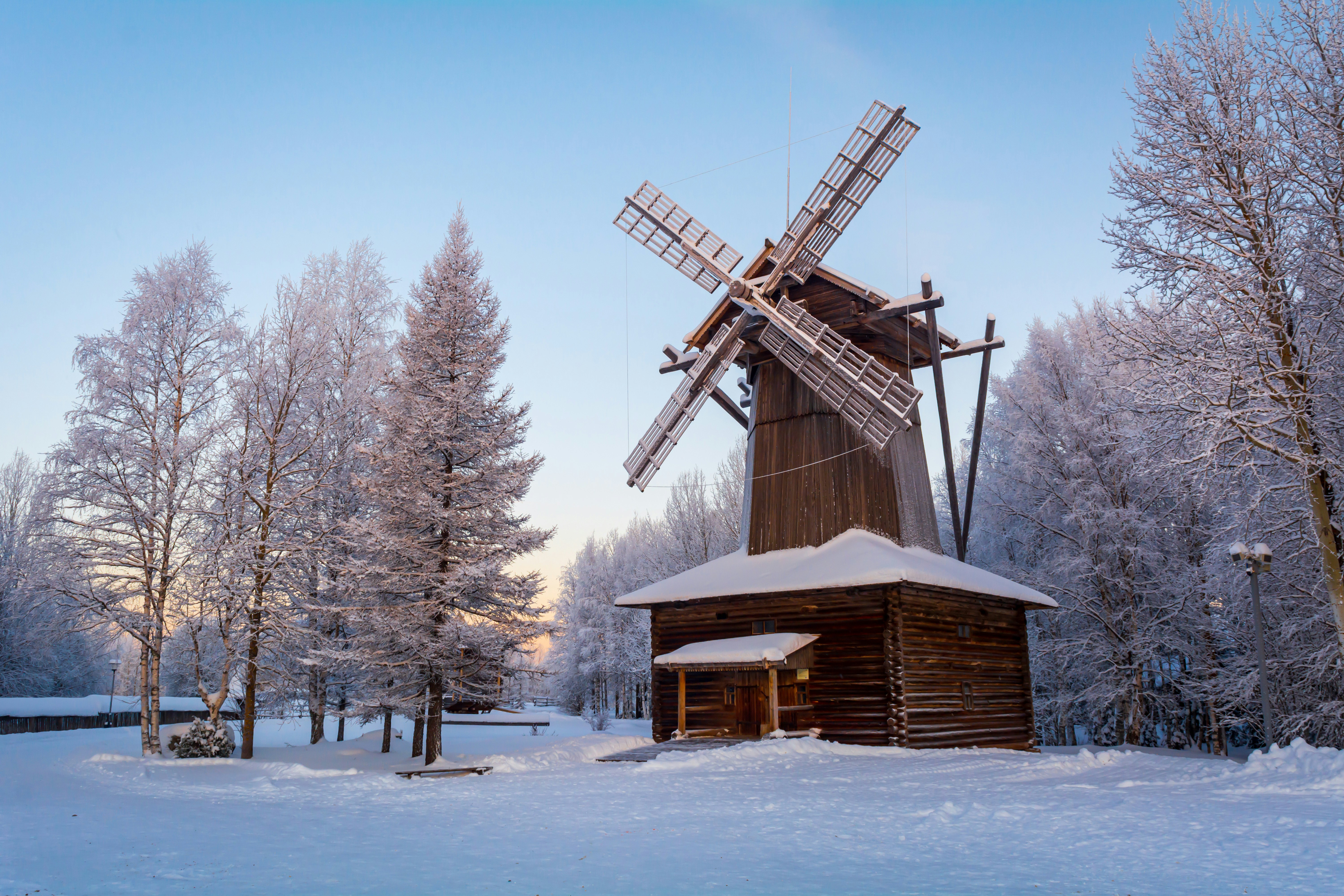 A windmill in the middle of a snowy field photo – Free Grey Image on ...