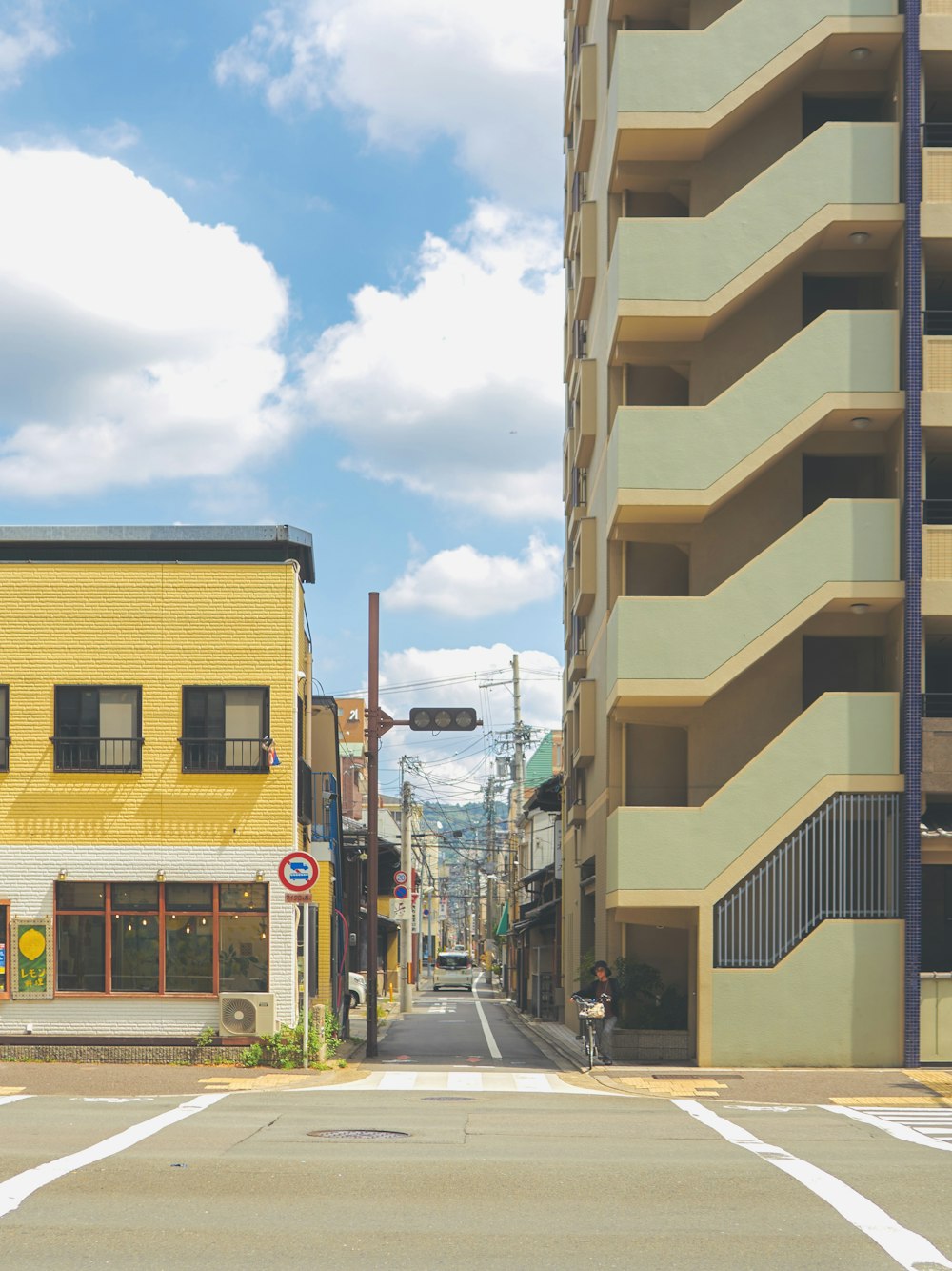 a yellow building on the corner of a street