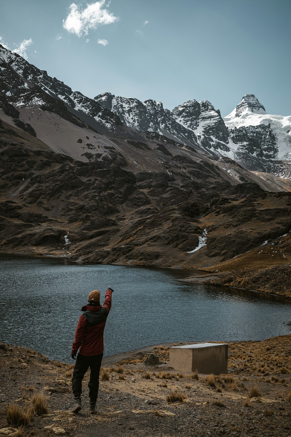 a person standing in front of a body of water