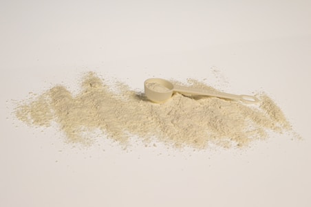 a scoop of powder next to a scoop of powder