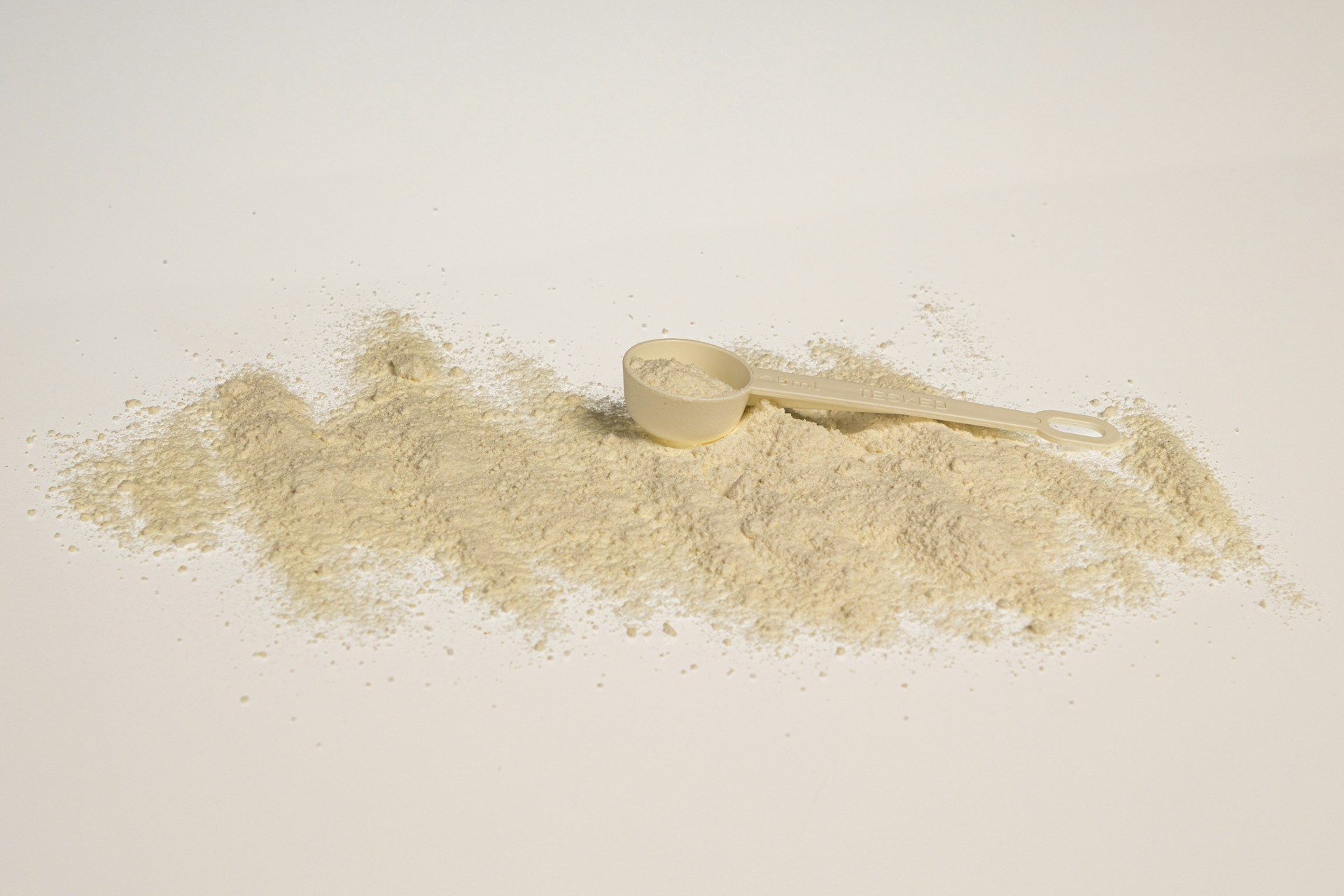 a scoop of powder next to a scoop of powder