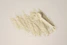 a scoop of powder and a scoop of powder on a white background