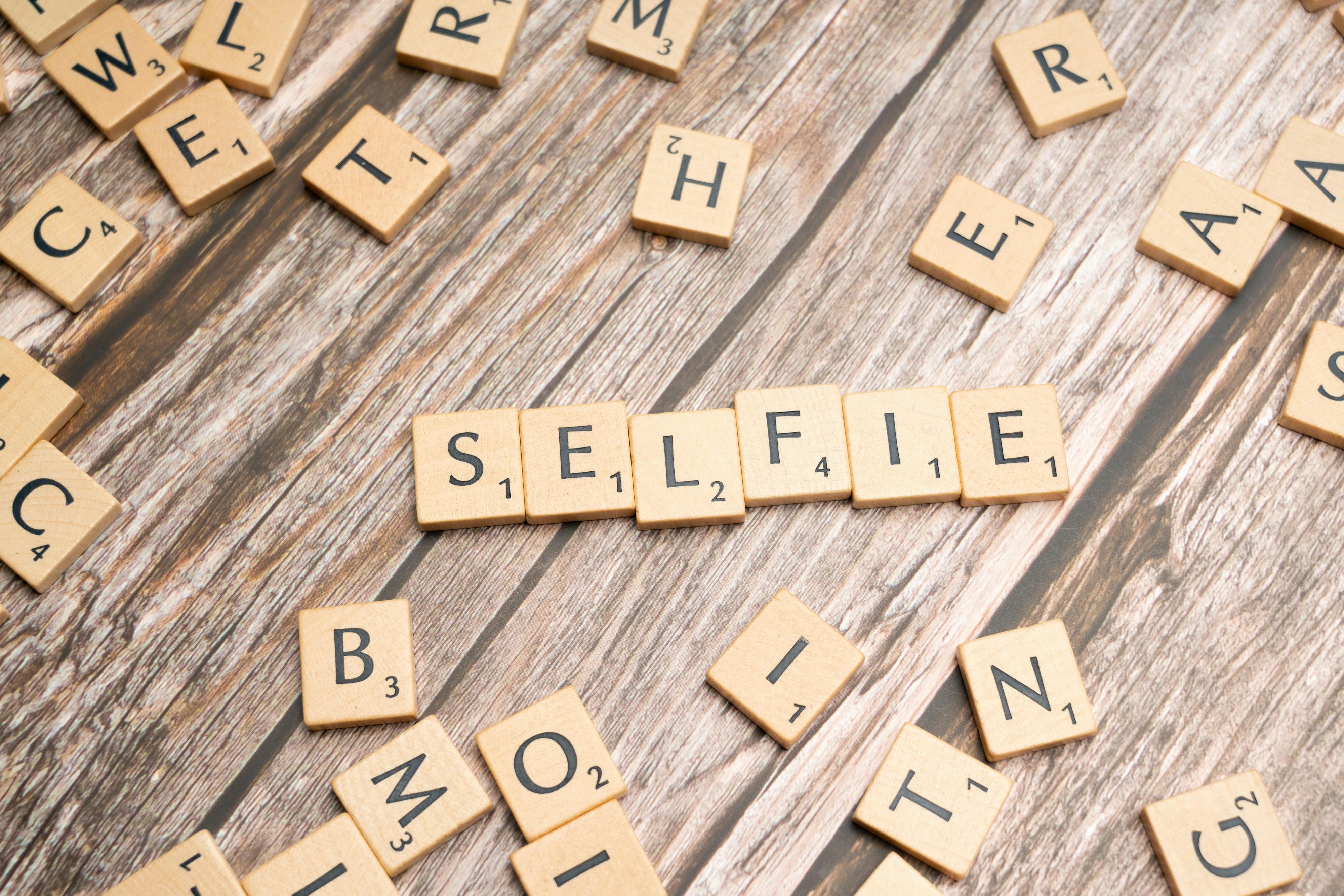 Scrabble letters spelling selfie