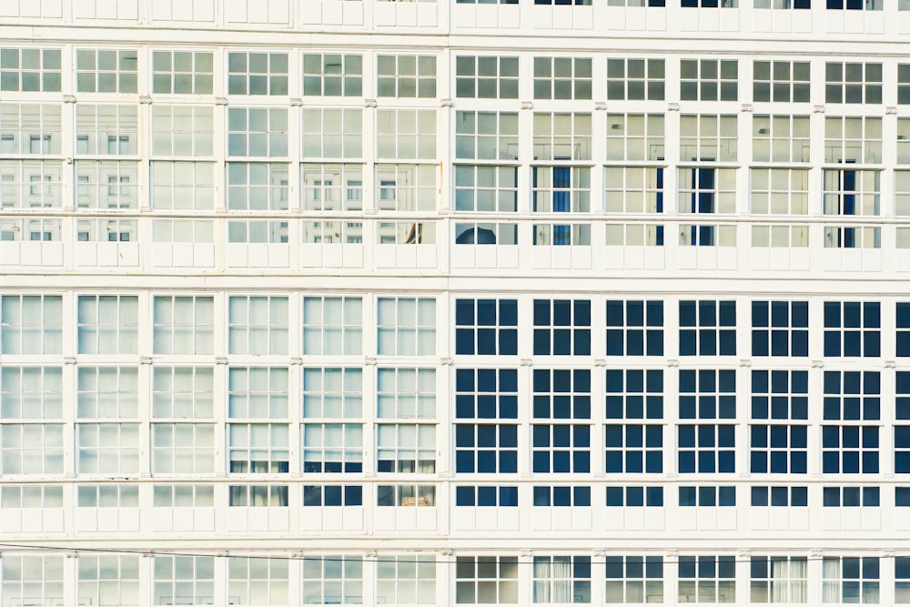 a white building with lots of windows on it