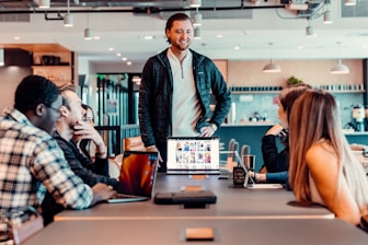 a group of people sitting around a table