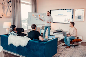 a man giving a presentation to a group of people