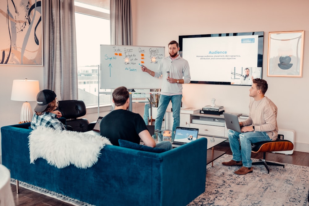 a man giving a presentation to a group of people