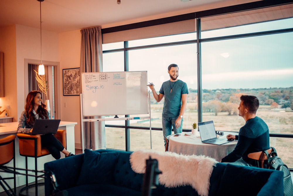 a man giving a presentation to a group of people